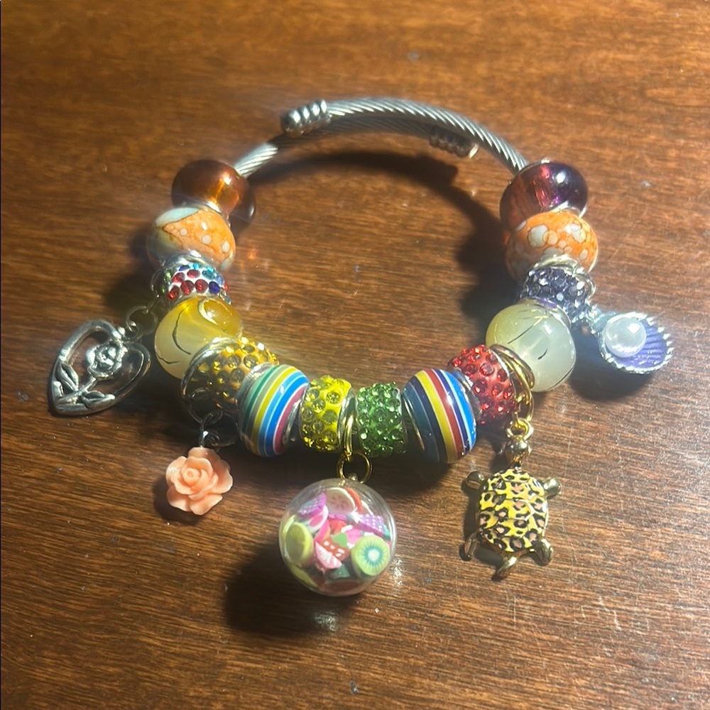 Red and Orange Eclectic Charm Bracelet with Silver Accents